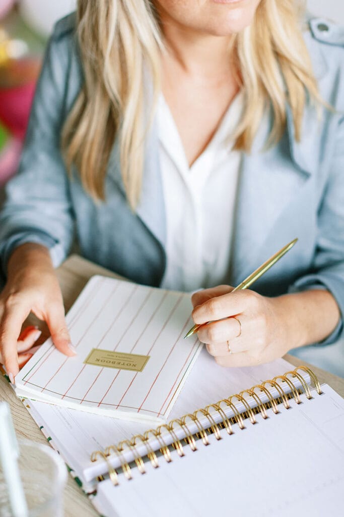 Woman in Blue blazer with planner