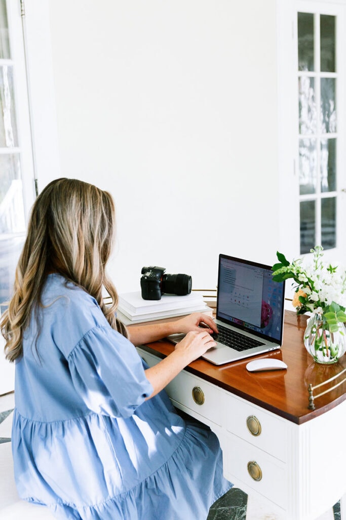 Women in Blue working on laptop